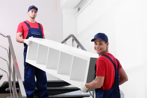 Local moving team handling furniture near Walthamstow streets