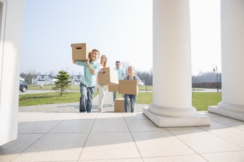 Furniture and boxes prepared for transport by man with a van