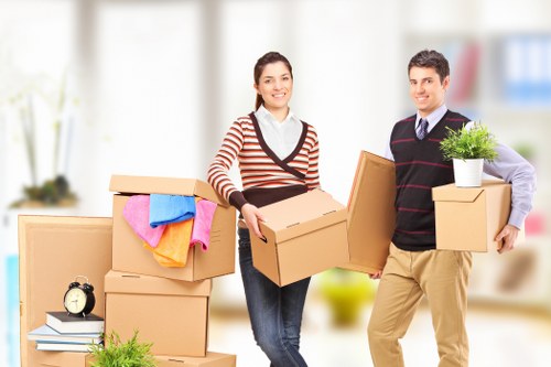 Business staff preparing boxes and labels before a commercial move