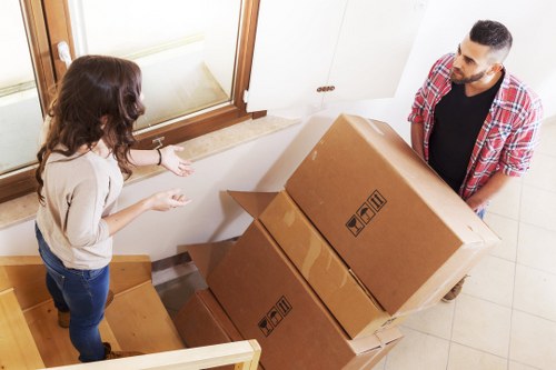 Local movers loading furniture on a residential street