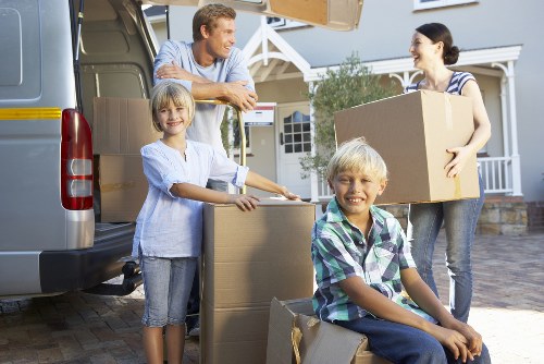 Loading furniture into a moving truck on a Walthamstow street