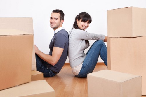Movers handling furniture during a house move in Walthamstow