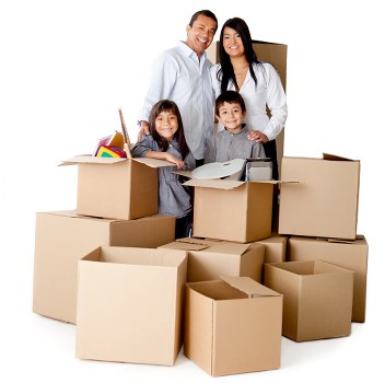 Packed moving boxes and furniture ready for house removals